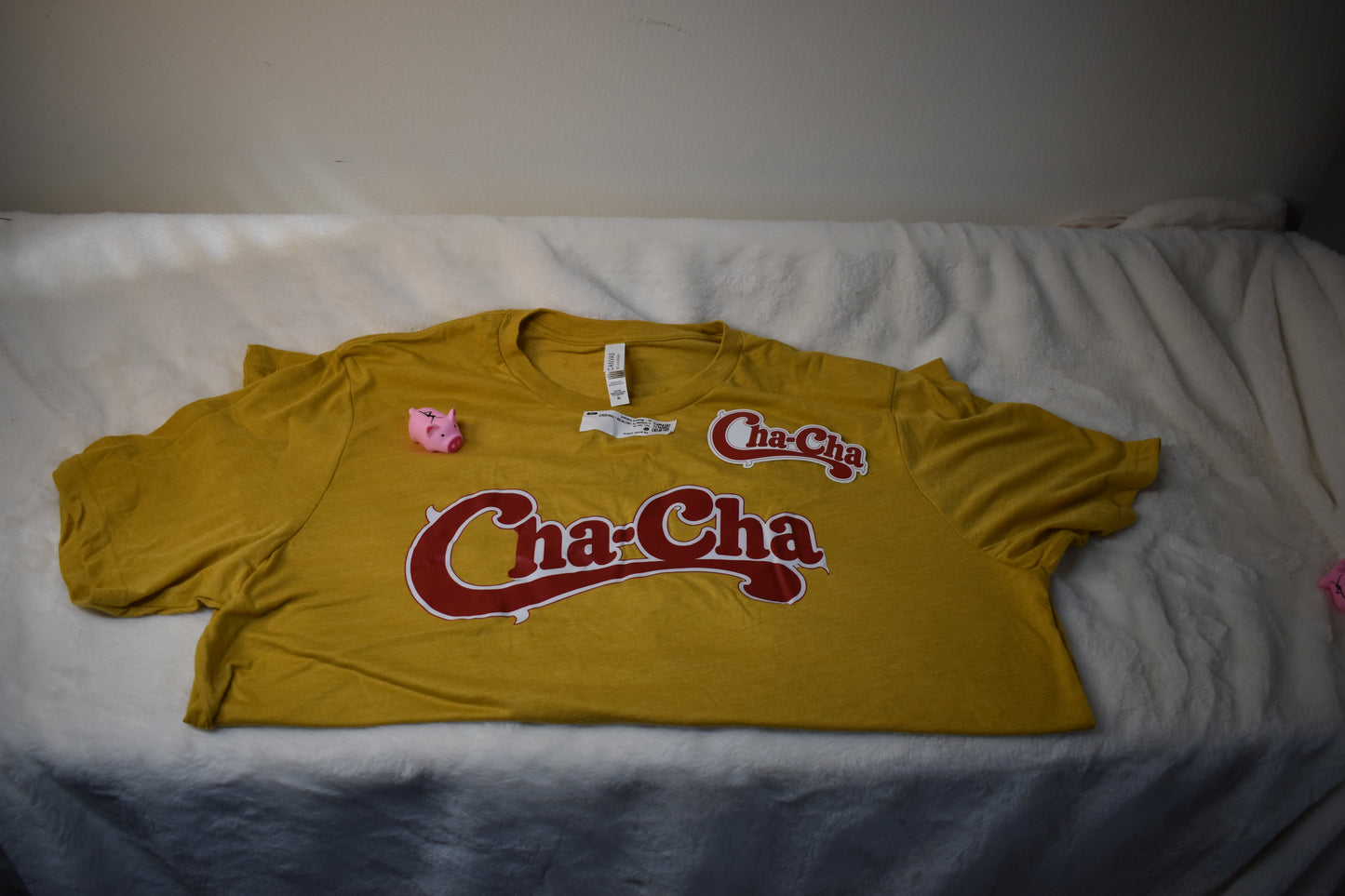 Cha-Cha Overstock Package – Unisex T-Shirt, Cha-Cha Vinyl Sticker, and Free Pig