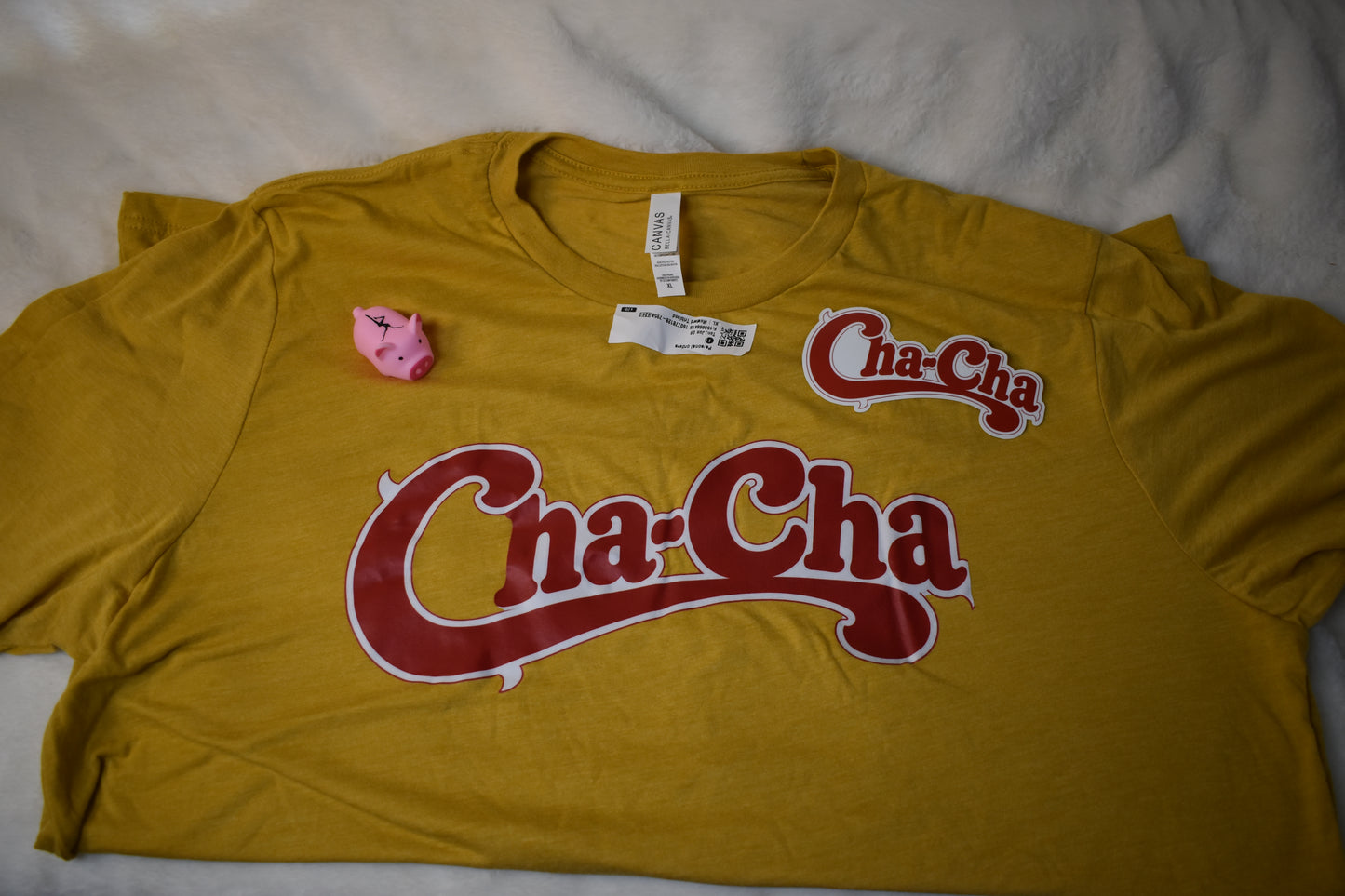 Cha-Cha Overstock Package – Unisex T-Shirt, Cha-Cha Vinyl Sticker, and Free Pig